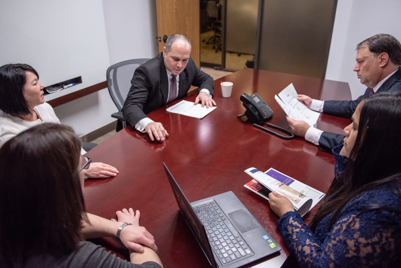 LS Global Advisors team working together in the office